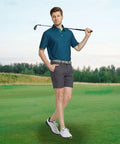 Man on golf course wearing mens golf polo shirt short sleeve dry fit moisture wicking performance print with breathable four way stretch collared top UPF 30