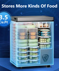 Compact Chest Freezer With Hella Spacious 3.5 Cu Ft Storage And Dang Quiet Cooling Plus Easy Peasy Temp Controls And Solid Grey Frame showing organized food storage in transparent bins.