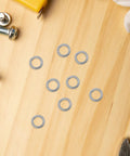 Heavy Duty Steel Split Lock Washers Stainless M6 Fastener Hardware 300 Pack on a wooden surface for engine work.