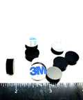 One Half Inch Round Silicone Rubber Bumper Feet Three Sixteenths Of An Inch Thick Adhesive Backed Spacer Pads scattered on ruler
