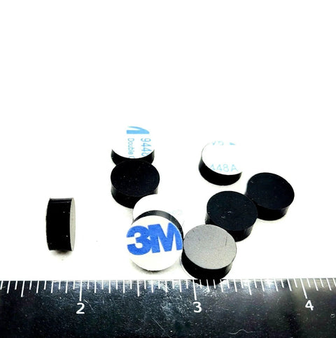 One Half Inch Round Silicone Rubber Bumper Feet Three Sixteenths Of An Inch Thick Adhesive Backed Spacer Pads scattered on ruler