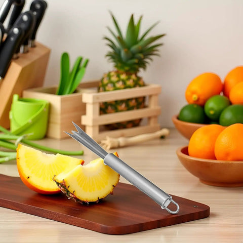 Sliced pineapple with V Shaped Stainless Steel Pineapple Eye Cutter And Remover Tool For Home Kitchen on cutting board