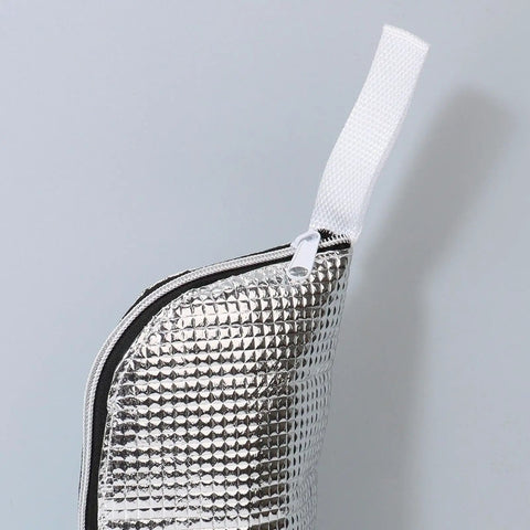 Insulated Bottle Cooler Bag and Thermal Tote with Triple Layer Insulation to Keep Your Morning Sips Frosty or Steaming Hot for Hours while Blocking Moisture and Drip Drama on the Go, silver insulated material close-up.