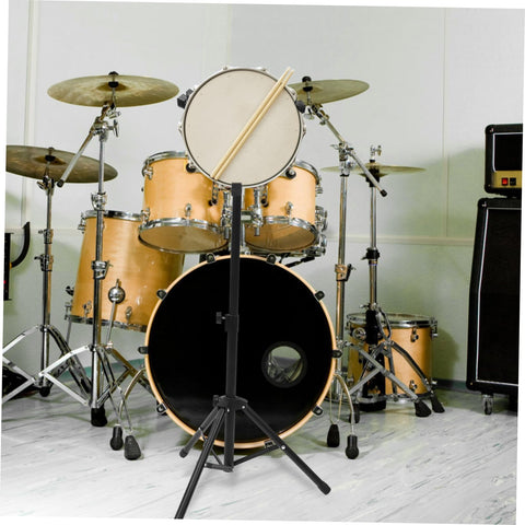 Straight Up Adjustable Height Alloy Snare Stand With Folding Practice Pad Rack black metal stand holding a snare drum with drumsticks.