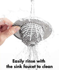 Reversible Chain Mesh Sink Strainer For Effortless Clean Up And Debris Catcher Large Capacity No Clog 304 Stainless Steel being rinsed