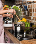 Person stirring pot on stove in kitchen with heavy duty high temperature leak stop tape for home plumbers multi purpose seal strip.