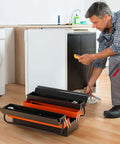 22-Inch Cantilever Tool Box With 5 Trays And 3 Layers open, showing tools, in a kitchen with a man repairing an appliance