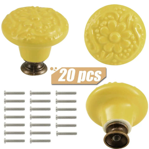 Totally Slick Yellow Ceramic Cabinet Knobs Featuring Dang Cute Embossed Floral Patterns Vintage Drawer Handles And Furniture Pulls For Kitchen Makeover Twenty Piece Pack with brass screws shown.