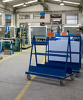 Warehouse with industrial carts on 8x2 Inch Heavy Duty Caster Wheels Set Of 4 Up To 3600 Pound Capacity Industrial Rubber Flat Tread Casters