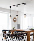 Slick Adjustable Black Track Lighting Pendants Offer No Sweat Setup And Kick Up Any Room While Fitting H Style Three Wire Tracks And Supporting Standard E26 Vintage Bulbs Pack Of 3 above a wooden dining table.