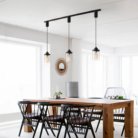 Slick Adjustable Black Track Lighting Pendants Offer No Sweat Setup And Kick Up Any Room While Fitting H Style Three Wire Tracks And Supporting Standard E26 Vintage Bulbs Pack Of 3 above a wooden dining table.