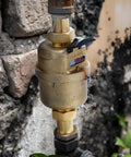 Three Quarter Inch Non Pulsed Rotary Piston Water Meter with heavy duty brass construction installed outdoors
