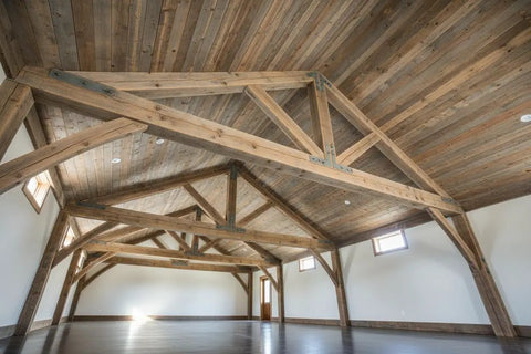 Chill Coastal Beachwood Water Based Wood Stain Zero VOC for interior use on wooden ceiling beams and planking in a spacious room.