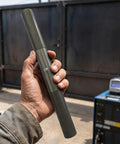 Hand holding Heavy Duty Weld On Trailer Ramp Hinges Forged From Premium Carbon Steel for easy installation and usage.