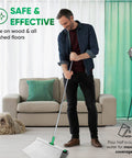 Man using huge wet floor wipes for squeegee stick, cleaning wood floor, couch and dog in the background, text overlay present.
