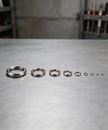 Open Spring Washer Set In 304 Stainless Steel For M2 Size Hardware, 480 Pieces For Machinery And Electronics, Anti Loosening Design, Rust Resistant Fasteners For Durable, Secure Assemblies And Easy Maintenance; M2 washers laid out by size