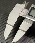 Close-up of Blade Style Electronic Caliper For Small Grooves, Stainless Steel Measuring Tool, 6 Inch 150mm Range on carbon surface