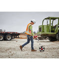 A survey professional using a Badass Replacement 12 Inch Digital Measuring Wheel Fits Model 48-22-5112 on a construction site.