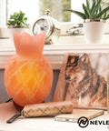 Rectangular pink Himalayan salt lamp with wood base on a table, surrounded by decor; handcrafted, includes 2 bulbs, dimmer cord