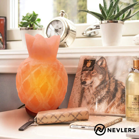 Rectangular pink Himalayan salt lamp with wood base on a table, surrounded by decor; handcrafted, includes 2 bulbs, dimmer cord