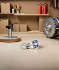 Heavy Duty Curtain Track Gliders 30 Pack with All Metal Bearings, shown on a wooden surface with other tools in a workshop.