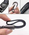Premium Leather Car Keychain Set For Toyota Corolla RAV4 Highlander showing close-up of hook and loop design in black.