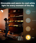 Woman arranging shelf in dimmable ambient light from Bluetooth 9ft Lightstrip Starter Kit With Hub For Hue Lighting.