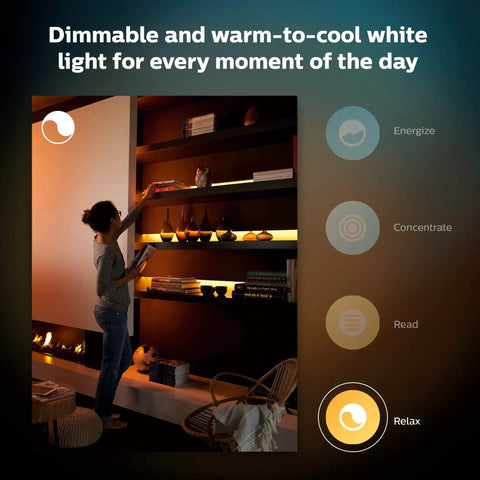 Woman arranging shelf in dimmable ambient light from Bluetooth 9ft Lightstrip Starter Kit With Hub For Hue Lighting.