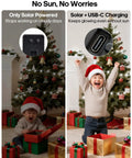 Child celebrating with Christmas gifts near a decorated tree, showcasing solar and USB-C charging options for lights.