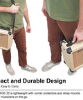 Person carrying G-Charge 20 Battery Powered Guitar Amplifier With 6.5 Inch Speaker, showing its compact and easy-to-carry design.