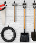 Six Pack Heavy Duty Garage Hooks 4.9 Inch Steel Utility Hangers organizing tools, hammer, saw, shovels, hose on brick wall