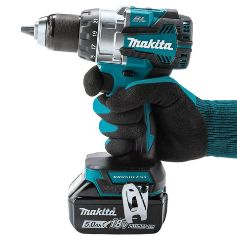 Kickin Amp 18V Brushless Cordless Drill Driver with metal chuck held in gloved hand, ideal for construction sites.