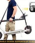 Heavy Duty Scooter Carry Strap With Quick Release Buckles And Anti Slip Pad For Electric Scooters Folding Bikes And Yoga Mats 55 Lb Capacity Lightweight Portable Easy On The Shoulders, man carrying folded scooter