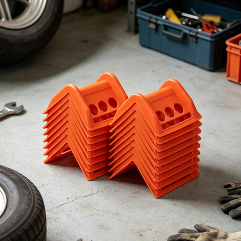 Orange 20 Pack Plastic Flatbed Edge And Corner Protectors For Trucks stacked in a garage with tools in the background.