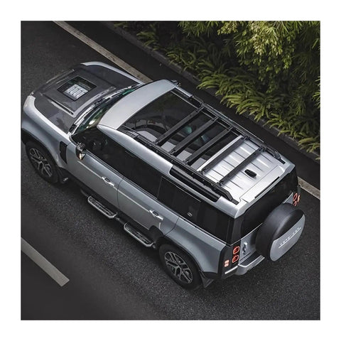 Heavy Duty Aero Roof Rack Built For Land Rover Defender 110 on silver vehicle, designed for hauling, reducing wind drag.