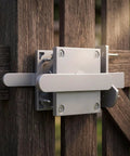 Amagogo Sliding Bolt Gate Latch-Heavy-Duty Steel Construction, Shielded Spray-Coated Finish, Latch with Double-Sided Handle, for Gates, Silver mounted on wooden fence.