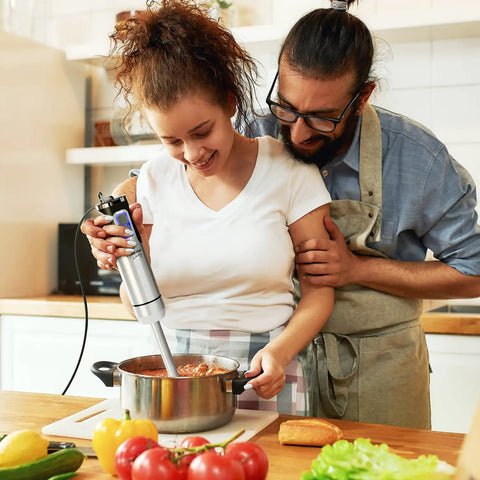 Couple using Ultra Power Immersion Hand Blender With 500W Motor And 8 Speed Turbo For Fast Blends in a kitchen setting