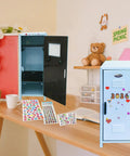 Fresh Blue Mini Metal Locker Box With Reliable Lock And Dope Decorative Stickers Compact Desktop Storage Organizer For Jewelry Cash Stash Girl Gifts Desk Neat Stack on a wooden table.