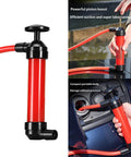 Grab This Nifty Manual Oil Extractor Pump Suction Tool For Quick Car Fluid Removal And Routine Maintenance Draining Without Any Power Cord Hassle, red handheld pump in use.