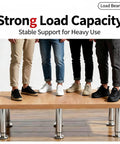 Four people standing on a wood table supported by Adjustable Metal Furniture Legs 4 Pack 4.7 To 7.08 Inches Electroplated Silver Replacement Feet