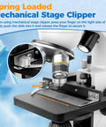 Close-up of spring-loaded mechanical stage clipper on Binocular Compound Microscope Kit For Kids And Adults 40X To 1000X Magnification
