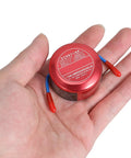 Self Activating Aerosol Fire Extinguisher For Car Engines And Boats With Instant Heat Trigger, held in hand for size reference.