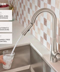 Top Shelf Pulldown Kitchen Faucet In Slick Spot Resist Stainless Steel with 360 swivel spray wand in action pouring water.