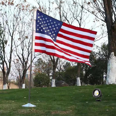 Low Voltage Landscape Spotlight Set 18W Outdoor Waterproof LED Path Lights illuminating American flag on lawn