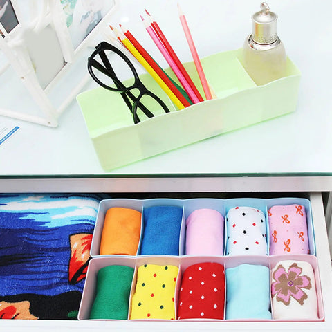 Stackable Plastic Drawer Organizers In Snazzy Pink For Crushing Closet Clutter And Laid Back Home Storage Setup holding colorful socks.