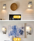 Room with 2-Pack Dope Modern Bathroom Wall Sconces in Brushed Nickel Finish with Frosted Glass Bright Vanity Lights mounted next to decor.