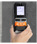 Straight Up Smooth Wall Scanner Featuring No Sweat Stud Detection And Deep Metal Sensor For Total DIY Home Repairs Plus Quick AC Voltage Tracking And Precision Moisture Measurement For Any Gig Project held against a wall, showcasing the display screen.