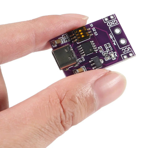 Person holding a small circuit board from Two Pack Type C PD Fast Charge Detector Kit QC AFC PD2.0 PD3.0 to DC Output Change Board.