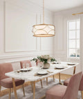Gold Drum Pendant Chandelier Light Fixture With White Fabric Shade above dining table, 4 light modern chandelier in elegant room.