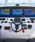 Boat helm with Four Gang Rocker Switch Panel With DIY Label Stickers And Pre Wired Jumpers SPST On Off 12V 20A And 24V 10A Aluminum Plate Red Ideal For LED Light Bars RV Boats And 4x4 Vehicles.